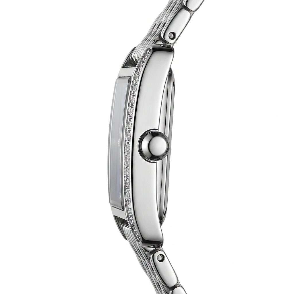 Close-up of a silver watch with a white background