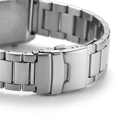 Close-up of a silver metal watch band on a white background