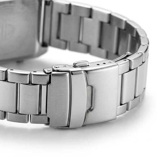 Close-up of a silver metal watch band on a white background
