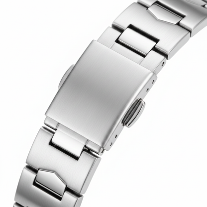 Close-up of a silver metal watch strap on a white background