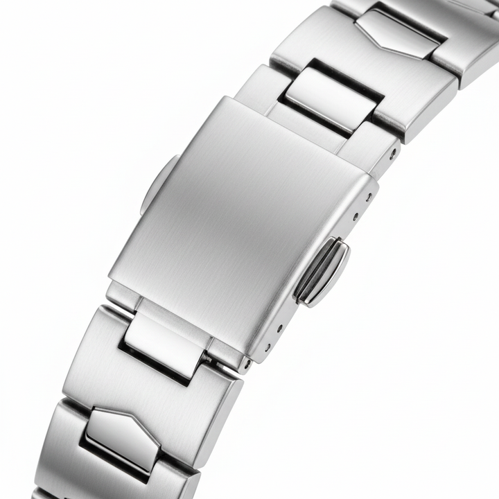 Close-up of a silver metal watch strap on a white background