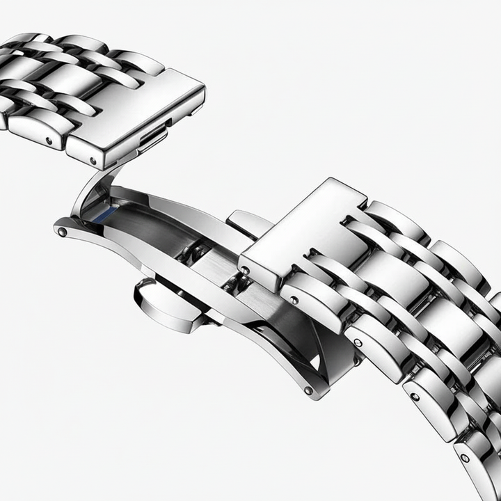 Close-up of a silver metal watch strap on a white background