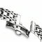 Close-up of a silver metal bracelet on a white background