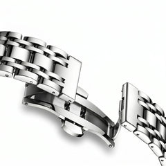 Close-up of a silver metal bracelet on a white background