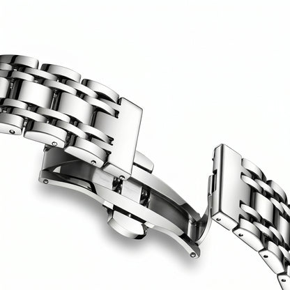 Close-up of a silver metal bracelet on a white background