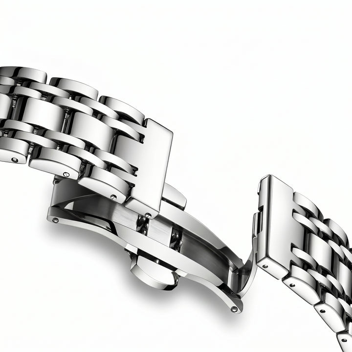 Close-up of a silver metal bracelet on a white background