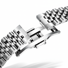 Close-up of a silver metal watch bracelet on a white background