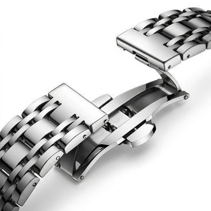 Close-up of a silver metal watch strap on a white background