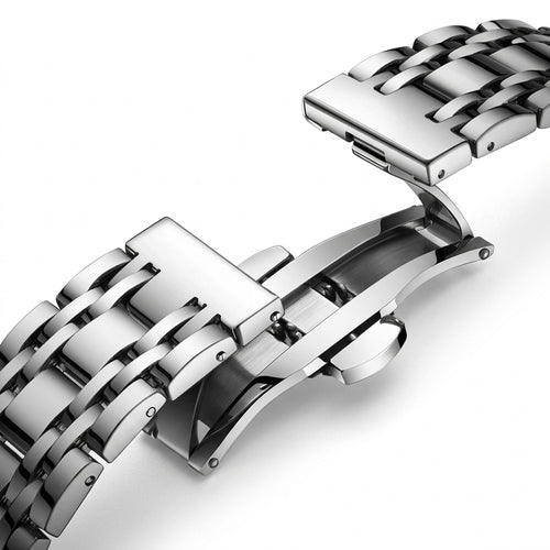 Close-up of a silver metal watch strap on a white background