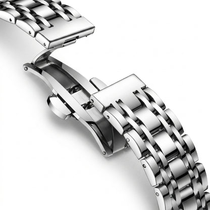 Close-up of a silver metal watch strap on a white background