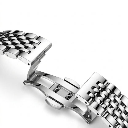 Close-up of a silver metal watch strap on a white background