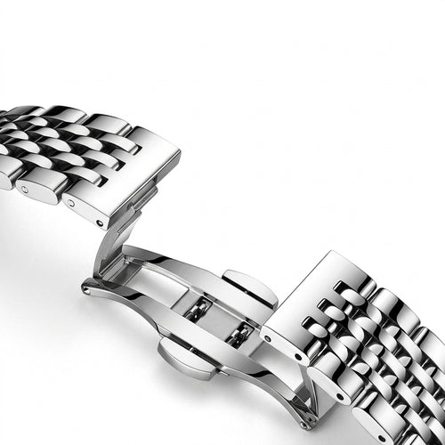 Close-up of a silver metal watch strap on a white background