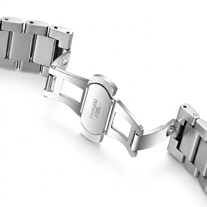 Close-up of a silver metal watch strap on a white background