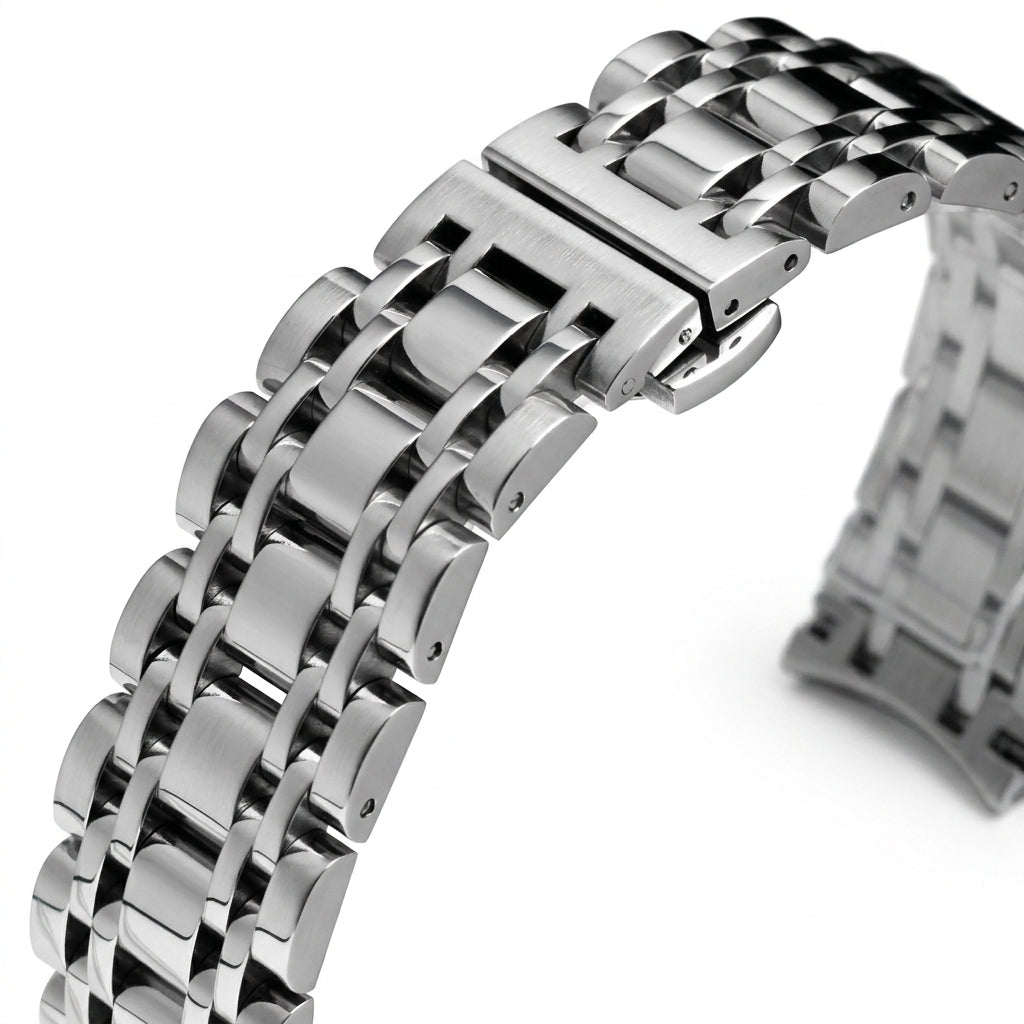 Close-up of a silver metal watch strap on a white background