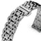 Close-up of a silver metal watch strap on a white background