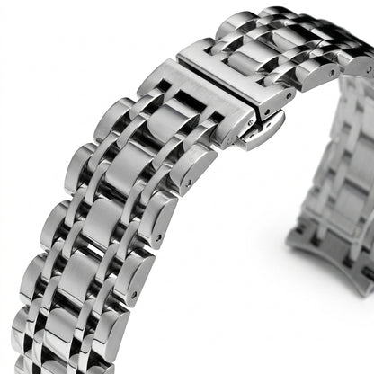 Close-up of a silver metal watch strap on a white background