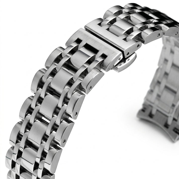 Close-up of a silver metal watch strap on a white background