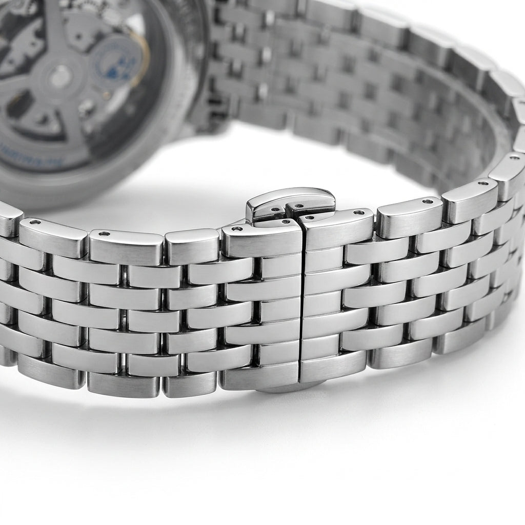 Close-up of a silver watch with a white background