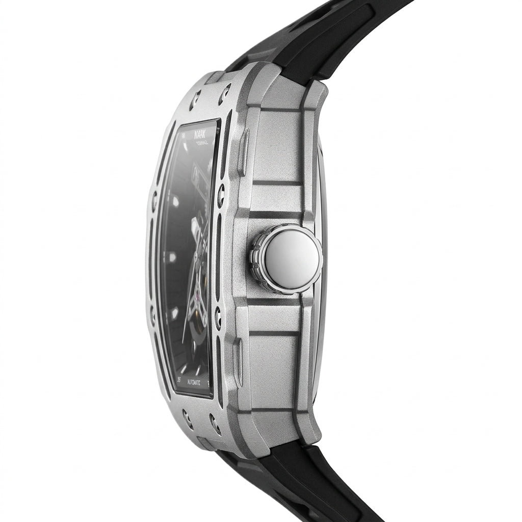 Close-up of a silver watch with a black strap on a white background