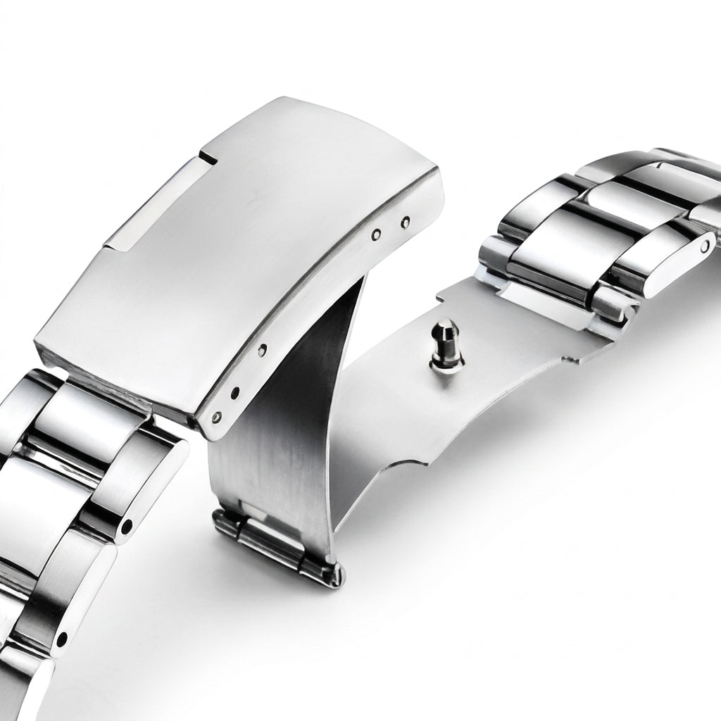 Close-up of a silver watch band on a white background