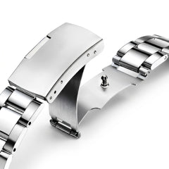 Close-up of a silver watch band on a white background