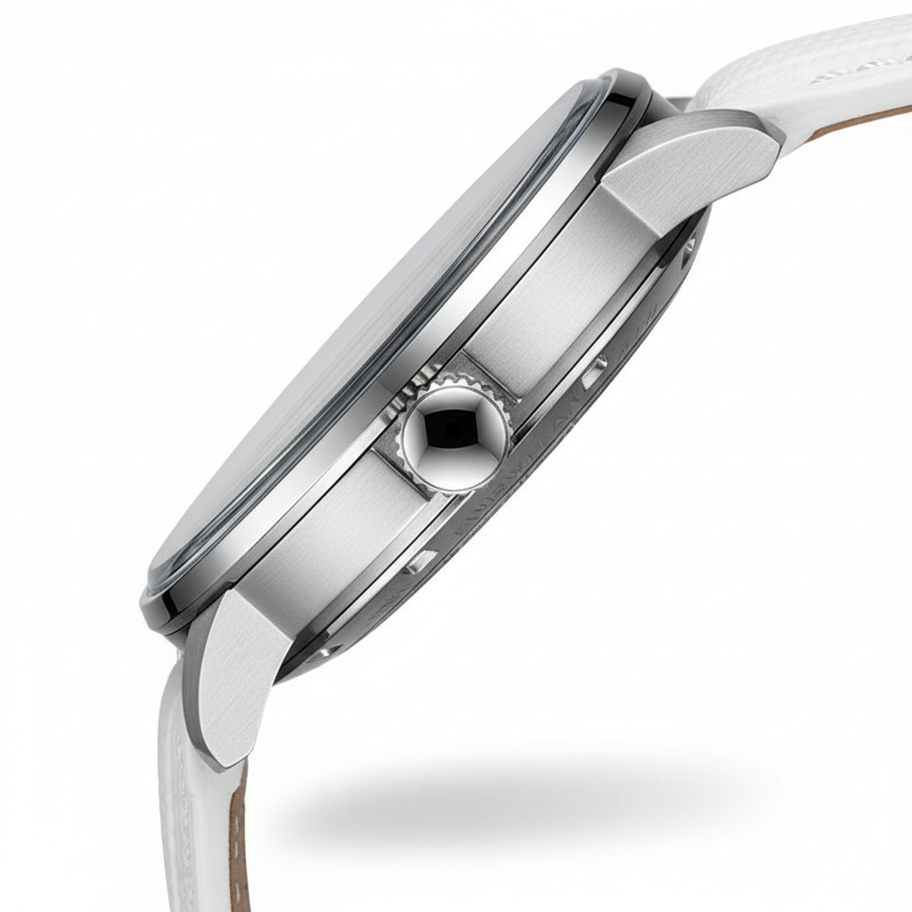 Close-up of a silver watch with a white strap on a white background