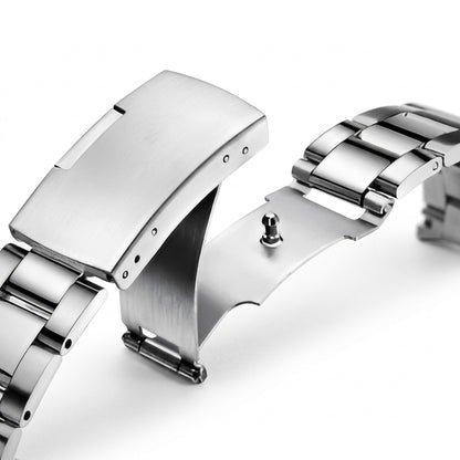 Close-up of a silver watch strap on a white background