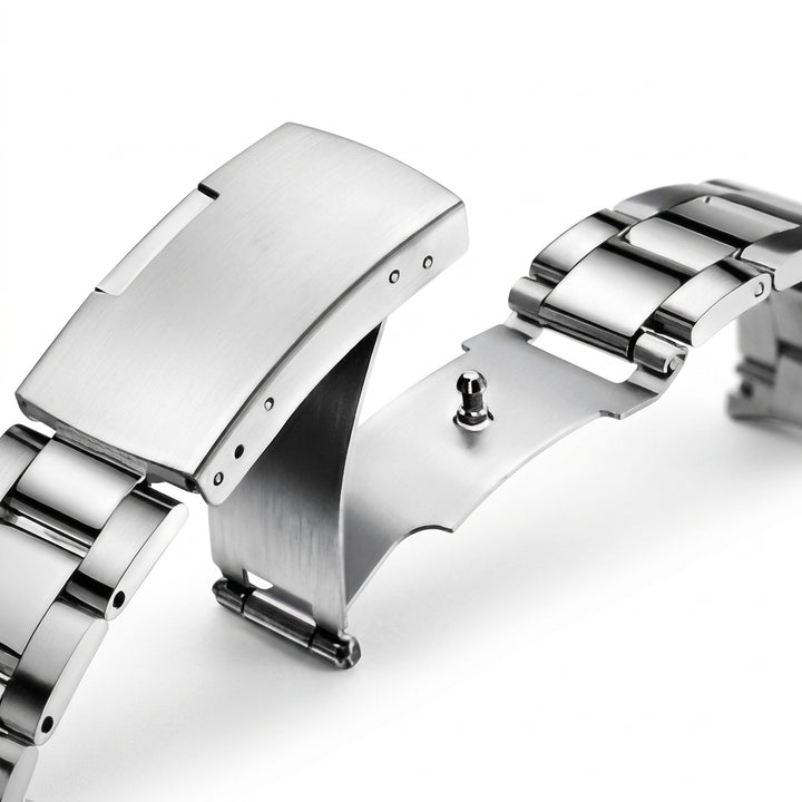 Close-up of a silver watch strap on a white background
