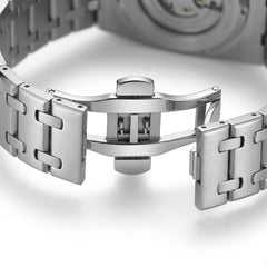 Close-up of a silver watch band on a white background