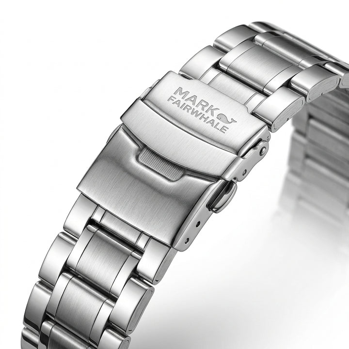 Close-up of a silver watch band with &