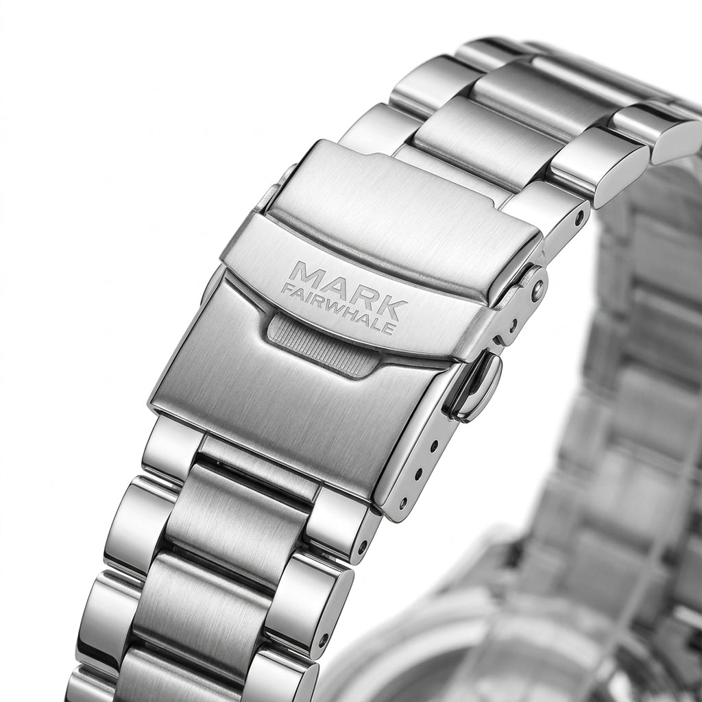 Close-up of a silver watch band with &