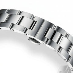 Close-up of a silver watch bracelet on a white background