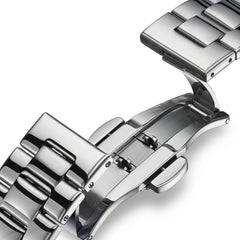 Close-up of a silver watch strap on a white background