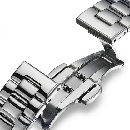 Close-up of a silver watch strap on a white background