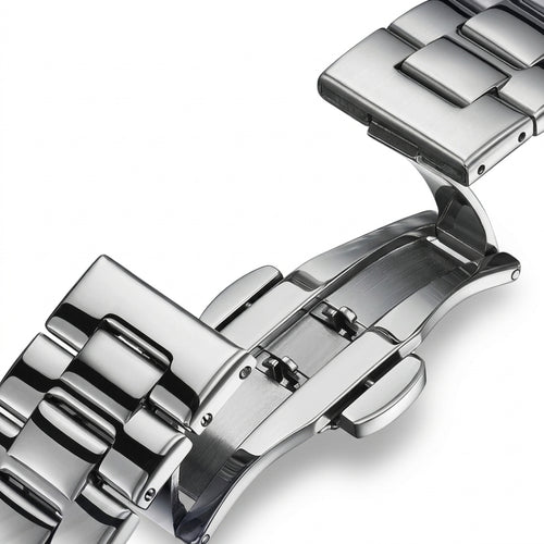 Close-up of a silver watch strap on a white background