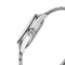 Close-up of a silver watch with a white background