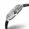 Close-up of a silver watch with a black strap on a white background