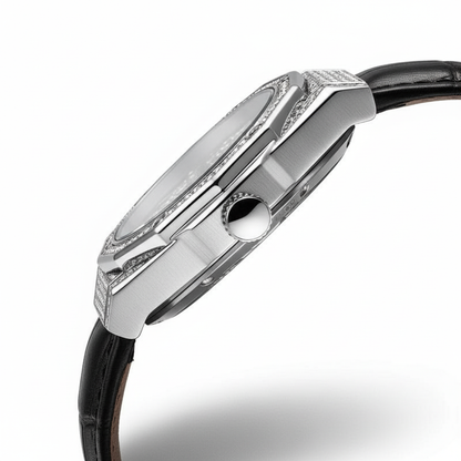 Close-up of a silver watch with a black strap on a white background