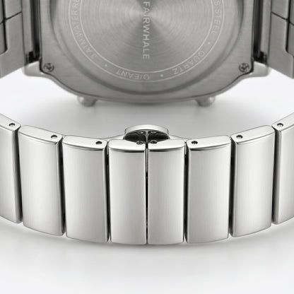 Close-up of a silver watch with a detailed metal band on a white background