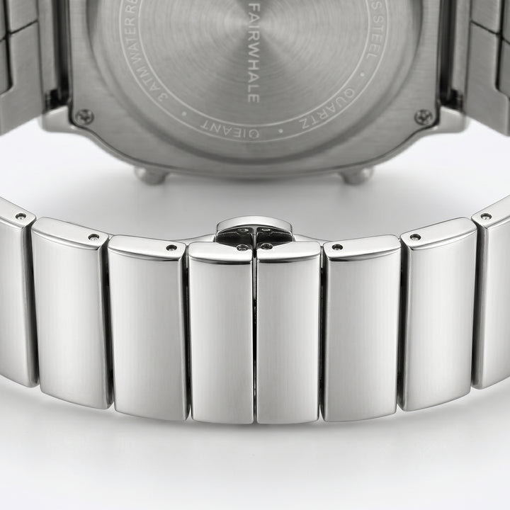 Close-up of a silver watch with a detailed metal band on a white background