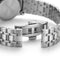 Close-up of a silver watch with a metal bracelet on a white background
