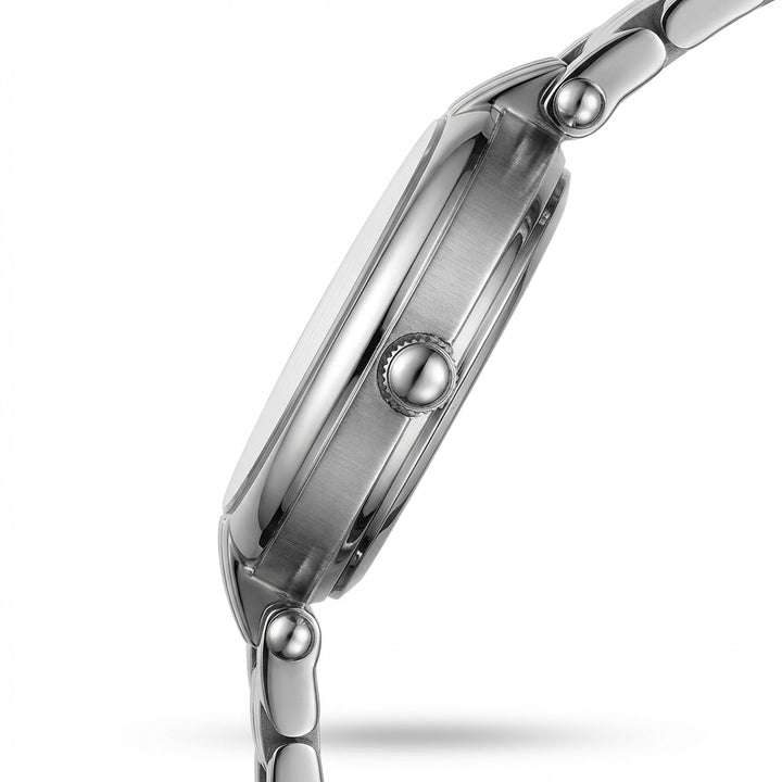 Close-up of a silver watch with a white background