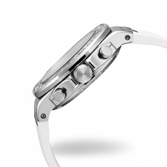 Close-up of a silver watch with a white strap on a white background