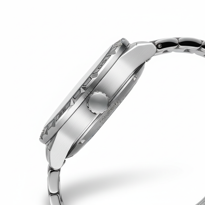 Close-up of a silver watch with detailed design on a white background