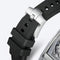Close-up of a watch with a black strap and silver case on a light gray background