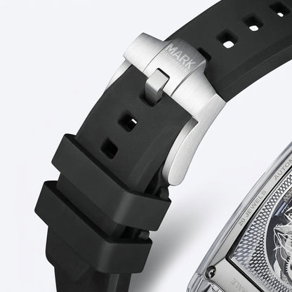 Close-up of a watch with a black strap and silver case on a light gray background