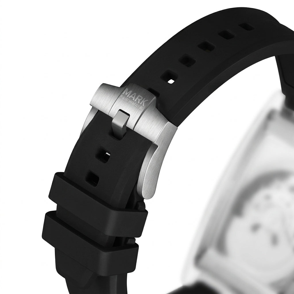 Close-up of a watch with a black strap and silver clasp on a white background
