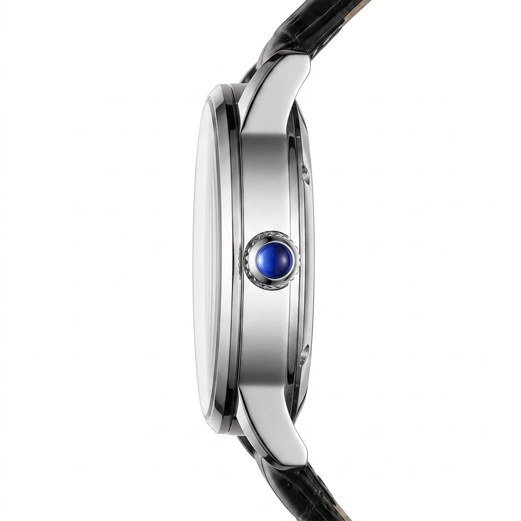 Close-up of a watch with a blue gemstone on a white background