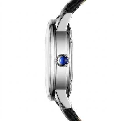 Close-up of a watch with a blue gemstone on a white background