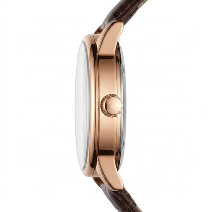 Close-up of a watch with a rose gold case and brown strap on a white background